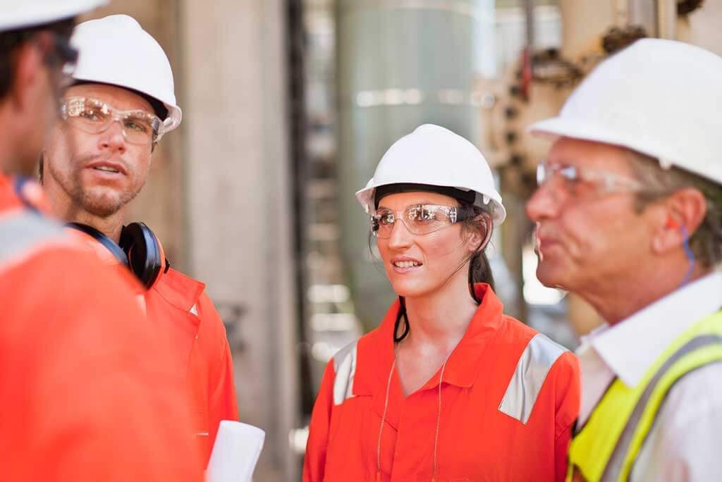 Construction workers wearing hearing protection on the job site. 